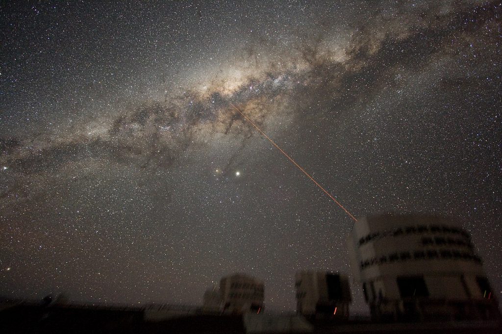 skytalk The Milky Way's Galactic Center in the night sky above the Paranal Observatory (the laser creates a guide-star for the telescope). ESO/Y. Beletsky