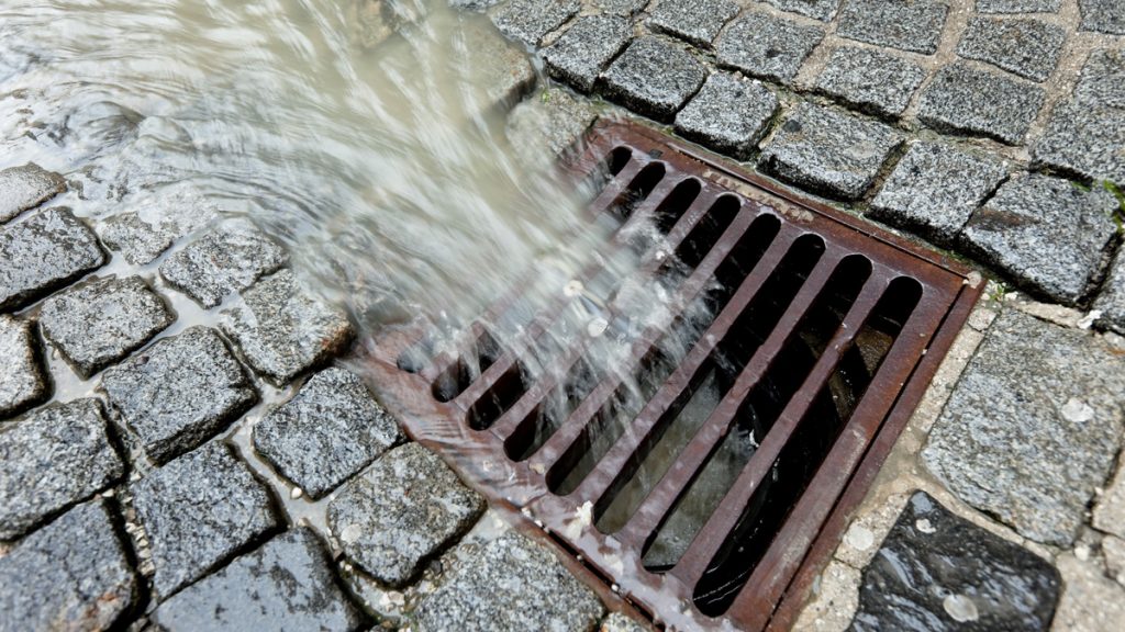 stormwater Metal lid of a channel for rain water (bigstockphoto.com)