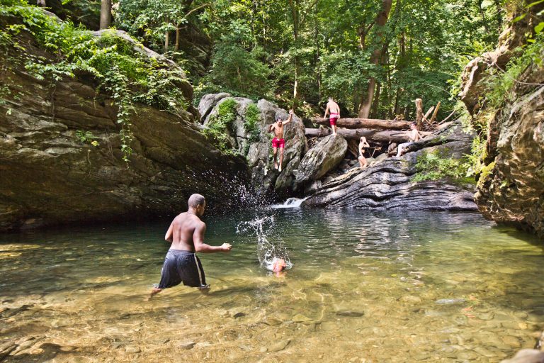 Swimmers cool off in the Devil’s Pool in Fairmount Park in Philadelphia. (Kimberly Paynter/WHYY)