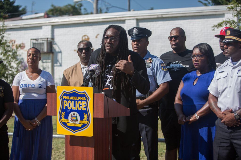 09 06 2018-e cohen ppd job fair presser-3 J. Jondhi Harrell is the executive director of The Center for Returning Citizens, which has partnered with the Philadelphia Police Department in an initiative to link employers with potential employees on Southwest Philadelphia street corners. (Emily Cohen for WHYY)
