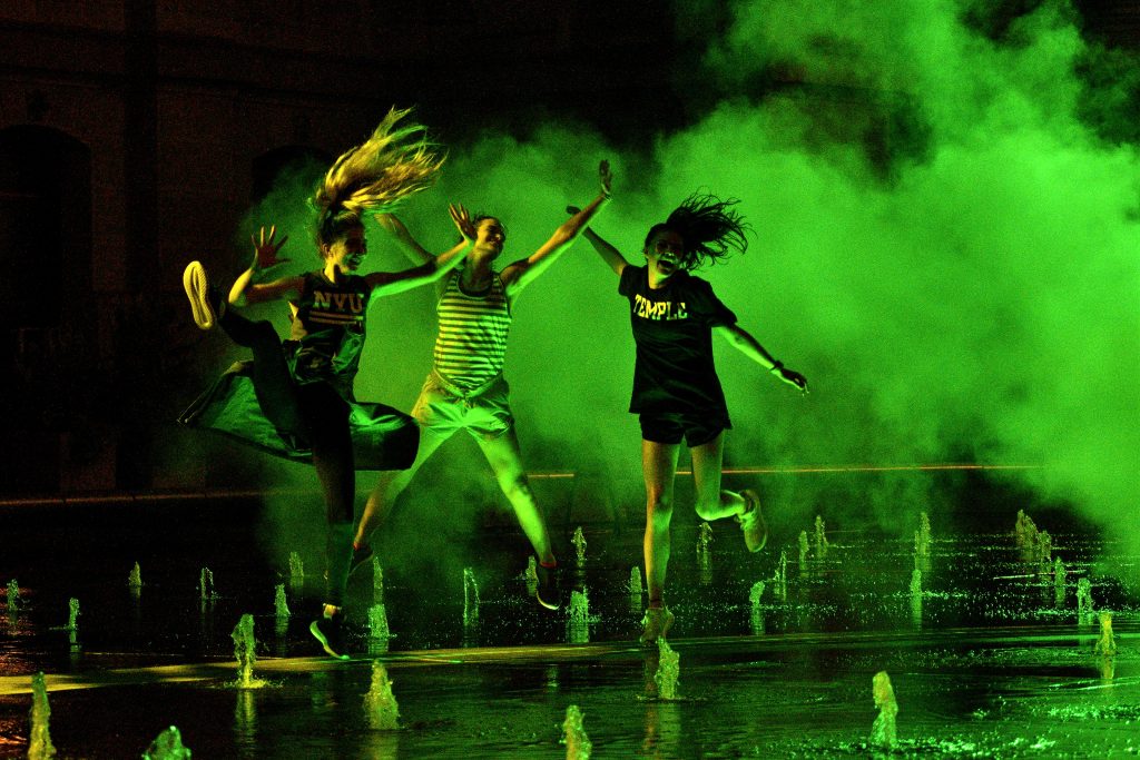 Pulse Light Art Instalation Unveiled at Dilworth Park’s Fountain Temple Students Olivia Chiaravalli, Shandler McNelis, and Alyssa Eder jump as the mist rolls past at the site-specific art installation titled