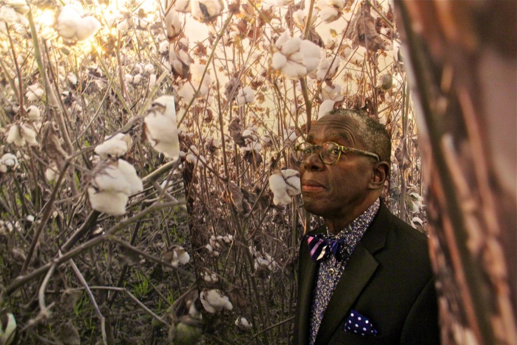 2018 09 14-e lee-john dowell-philadelphia african american museum-cotton exhibit Artist John Dowell moves through his installation,