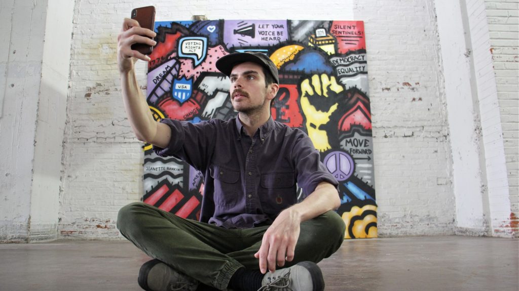 2018 09 25-e lee-conrad benner-philadelphia-voting exhibit Conrad Benner takes a selfie in front of Alloyius Mcilwaine's