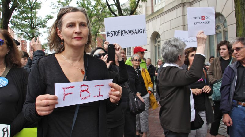 About 200 protesters gather outside the United States Custom House at 200 Chestnut Street to voice their objections to Brett Kavanaugh as a nominee for the U.S. Supreme Court in light of sexual assault allegations. (Emma Lee/WHYY)