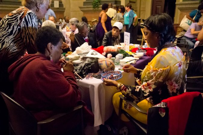 About 100 crocheters and knitters gathered at City Hall to create warm clothes for homeless people. (Kimberly Paynter/WHYY)