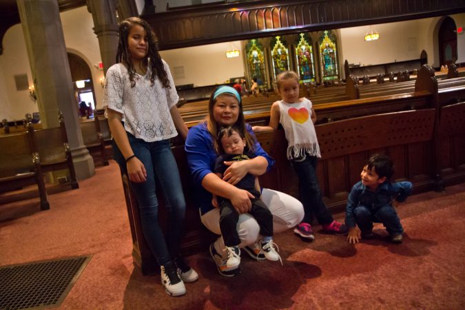 Suyapa Reyes and her children take sanctuary at the First United Methodist Church of Germantown. (Kimberly Paynter/WHYY)