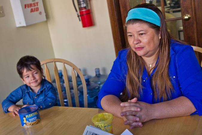 Suyapa Reyes moved to the U.S. from Honduras about five years ago. Her son Jeison, 2, was born in the and is a citizen. After receiving a deportation notice, Reyes and her son, and other children took sanctuary at the First United Methodist Church of Germantown. (Kimberly Paynter/WHYY)
