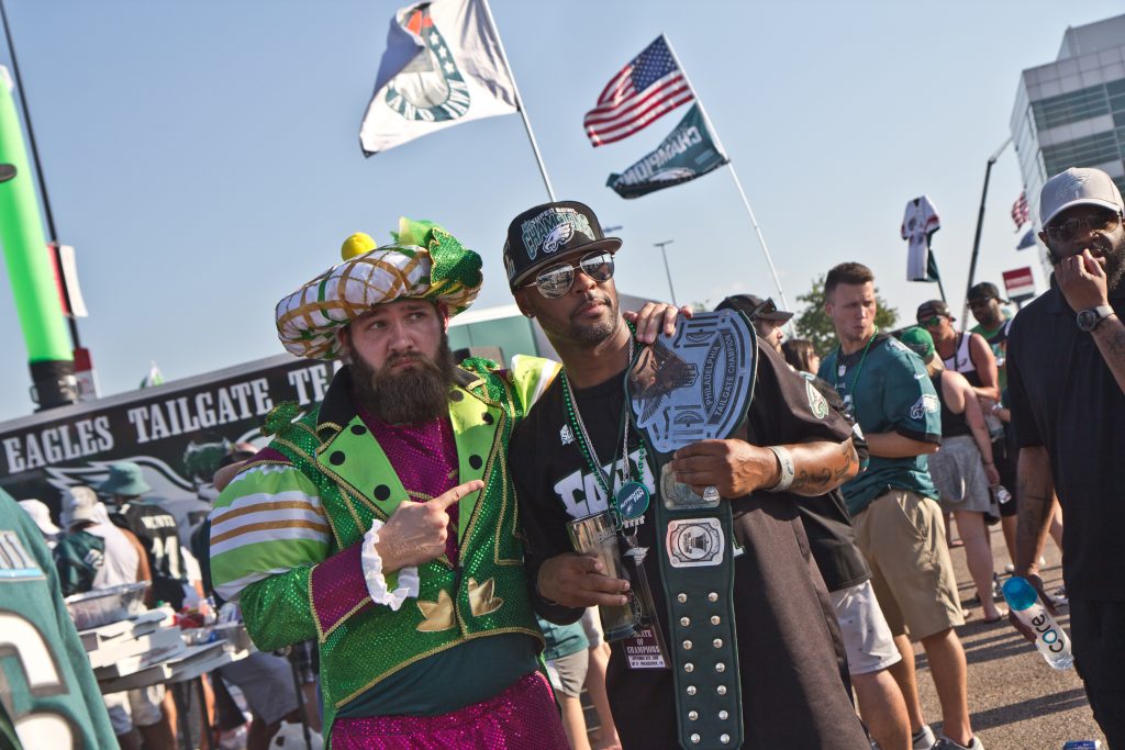 2018 9 6 k paynter eagles opening day-13 Brennen Dickerson take a photo with Michael Suggs, who traveled from San Antonio to attend the game. (Kimberly Paynter/WHYY)