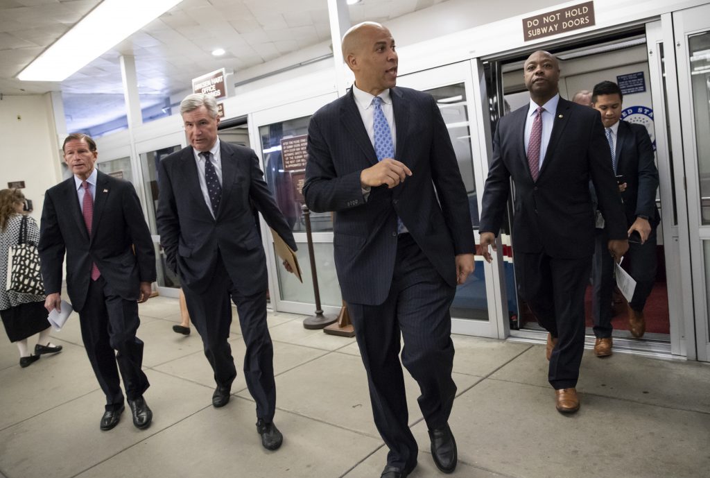 Richard Blumenthal, Sheldon Whitehouse, Cory Booker, Tim Scott (From left), Sen. Richard Blumenthal, D-Conn., Sen. Sheldon Whitehouse, D-R.I., Sen. Cory Booker, D-N.J., and Sen. Tim Scott, R-S.C., arrive at the Capitol for a procedural vote on an appropriations measure, in Washington, Thursday, Aug. 23, 2018. (J. Scott Applewhite/AP Photo)