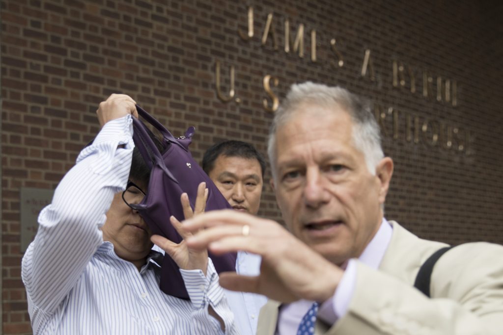 Yu Xue, Peter Zeidenberg Yu Xue, left, accompanied by her attorney Peter Zeidenberg attempts to block her face with her bag as they exit the federal courthouse in Philadelphia last month. A co-conspirator, Tao Li, pleaded guilty Friday to stealing biopharmaceutical trade secrets from GlaxoSmithKline in what prosecutors said was a scheme to set up companies in China to market them. (AP Photo/Matt Rourke)