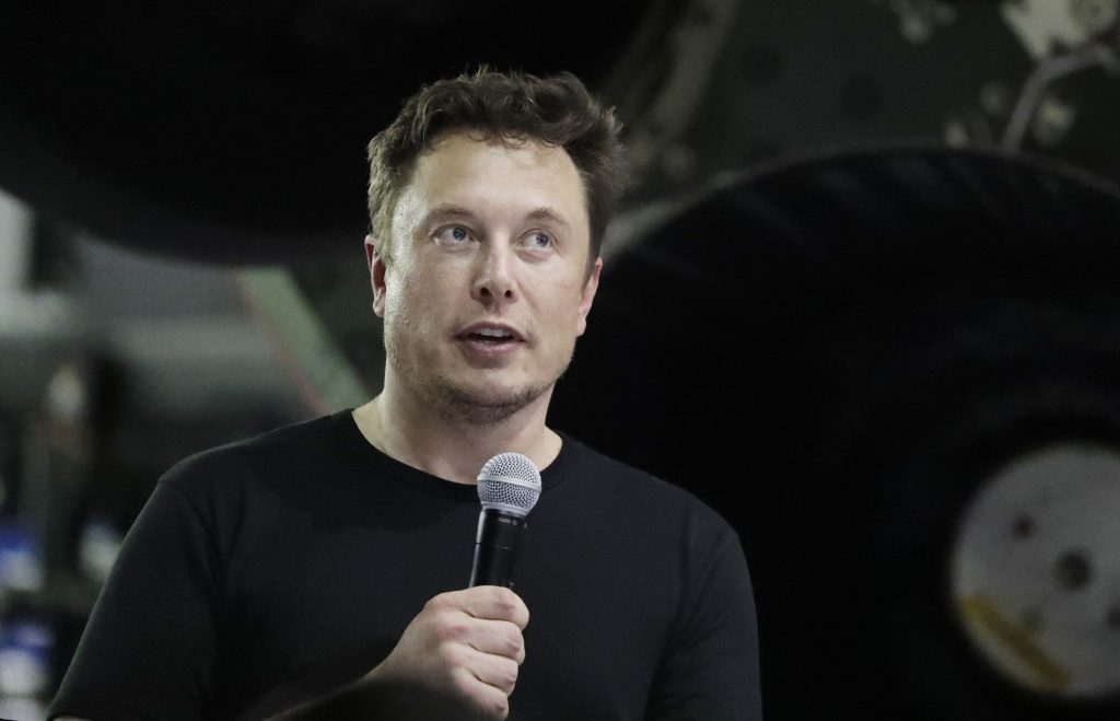 Tesla Criminal Investigation In this Monday, Sept. 17, 2018, file photo Tesla CEO and SpaceX founder and chief executive Elon Musk speaks after announcing Japanese billionaire Yusaku Maezawa as the first private passenger on a trip around the moon in Hawthorne, Calif. Tesla Inc. has turned over documents to the U.S. Justice Department after statements by Musk about taking the company private, the electric car maker confirmed Tuesday, Sept. 18. (Chris Carlson/AP Photo, File)