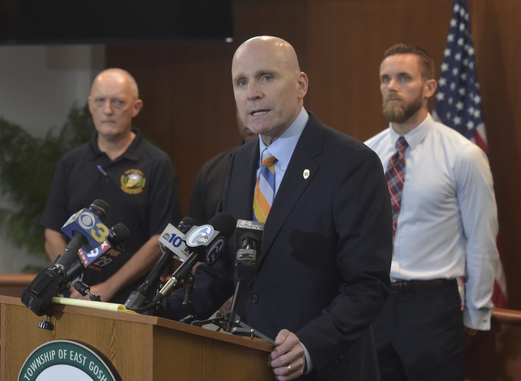 Tom Hogan Chester County District Attorney Tom Hogan speaks about the shooting at Bellingham Retirement Community on East Boot Road in East Goshen Township, Pa., Wednesday, Sept. 19, 2018. Authorities are searching for a man who they say shot at his ex-wife and then killed his parents at the retirement center. Hogan says authorities are looking for 59-year-old Bruce Rogal of Glenmoore. (Pete Bannen/Daily Local News via AP)
