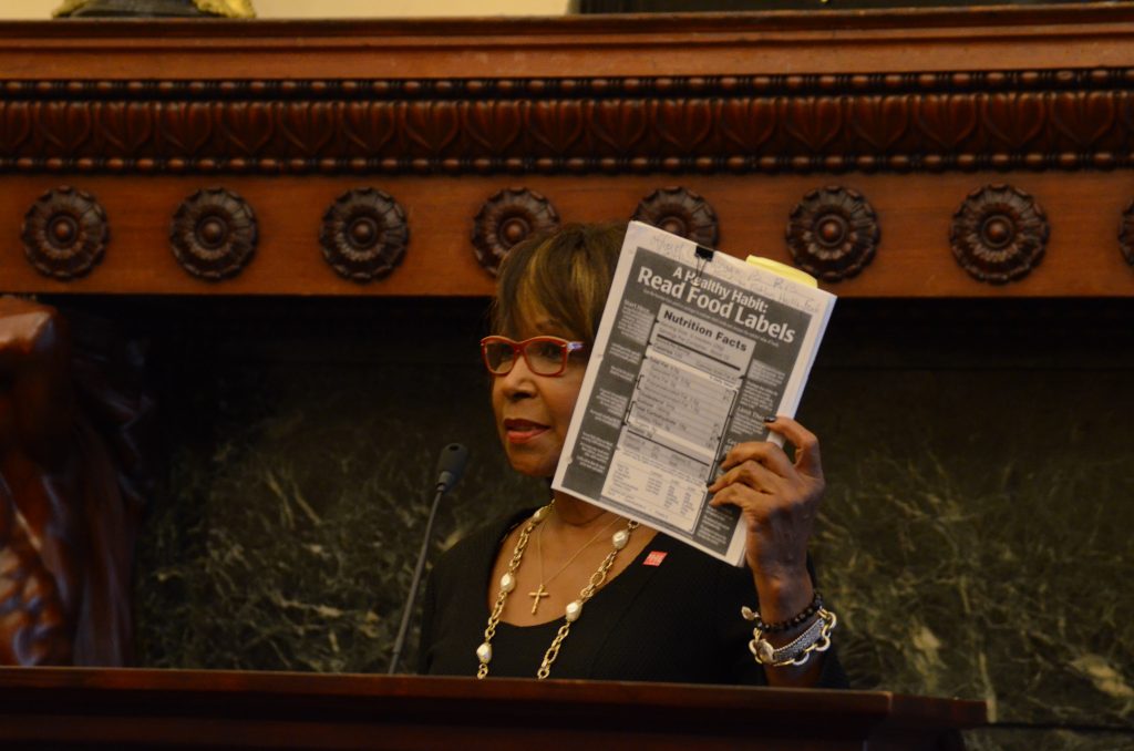 BRB 9-14 Philadelphia Councilwoman Blondell Reynolds-Brown holds up a test to check for excessive salt in food. A new city law requires restaurants to warn diners of high-sodium menu items. (Tom MacDonald/WHYY)