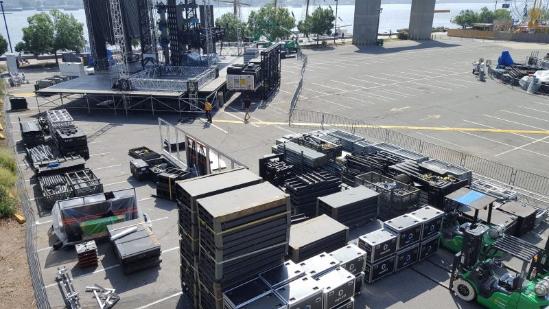 Workers get Penn's Landing ready for 
Thursday's NFL Kickoff Experience. (Sara Hoover for WHYY)