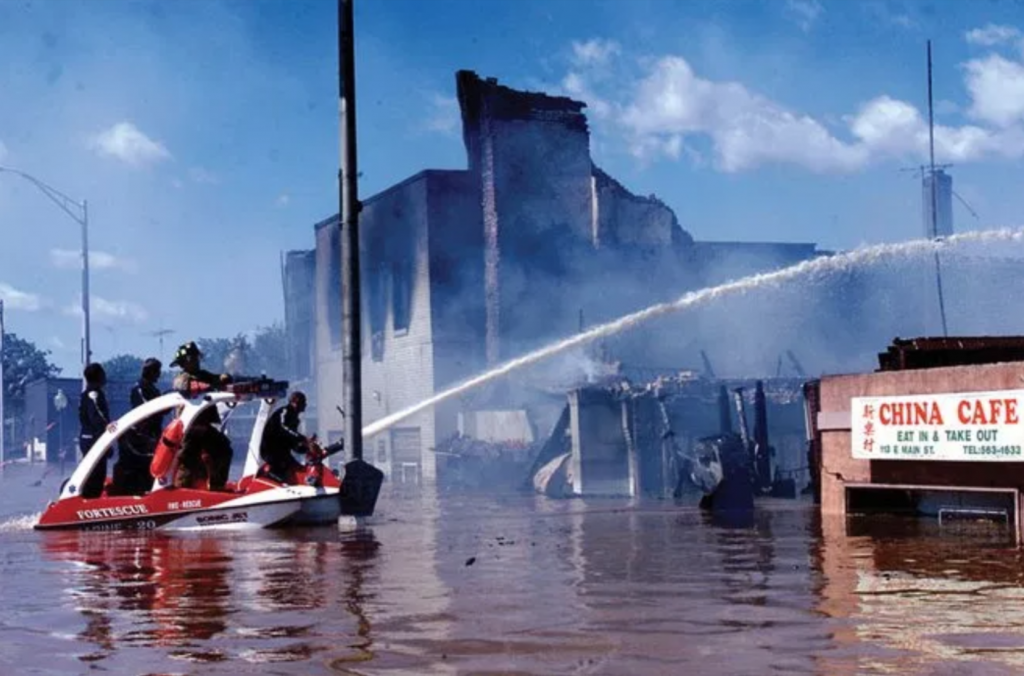 Screen Shot 2018-09-16 at 6.35.52 PM Firefighters battle a fire in flood ravaged Bound Brook, New Jersey during Tropical Storm Floyd in Sept. 1999.
