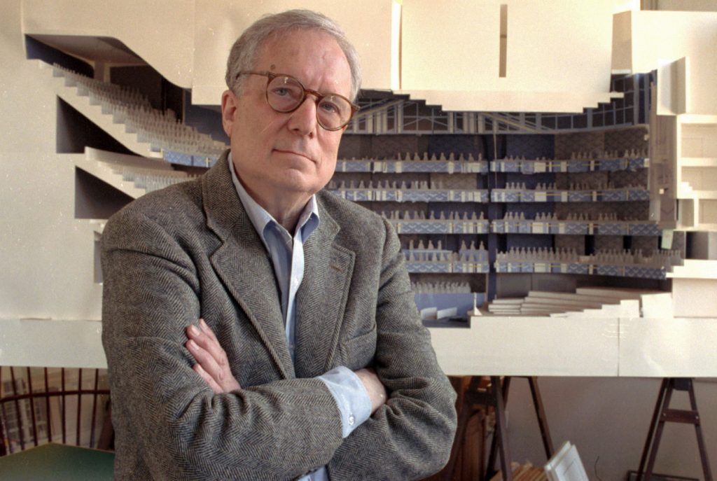 ROBERT VENTURI FILE - In this April 1991 file photo, architect Robert Venturi poses in his office in the Manayunk section of Philadelphia, with a model of a new hall for the Philadelphia Orchestra in background. Venturi, who turned austere modern design on its ear, ushering in postmodern complexity with the dictum