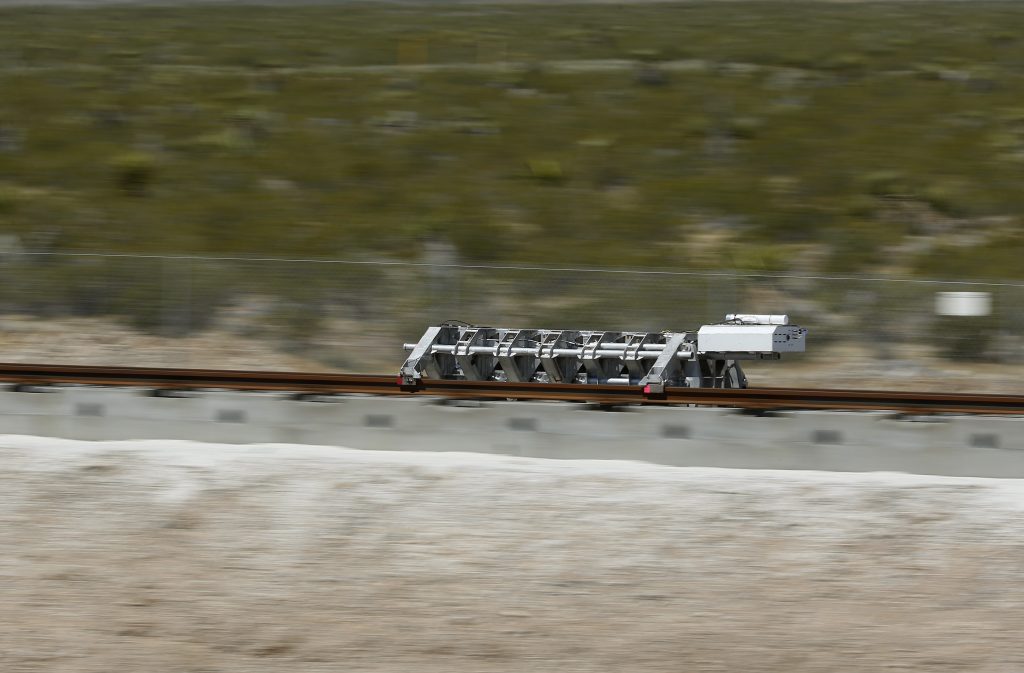 Hyperloop Test A sled speeds down a track during a test of a Hyperloop One propulsion system, Wednesday, May 11, 2016, in North Las Vegas, Nev. The startup company opened its test site outside of Las Vegas for the first public demonstration of technology for a super-speed, tube based transportation system. (AP Photo/John Locher)