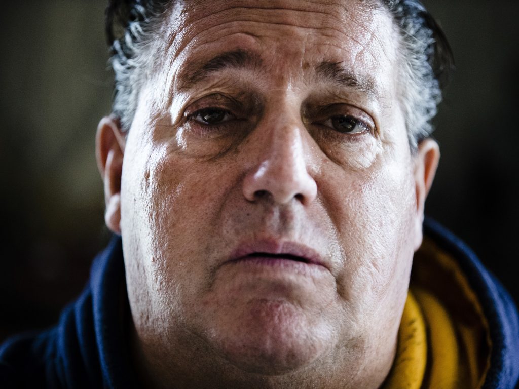 Anthony Torres poses for a photograph at his brother's home in Atco, N.J., after revealing he was the man caught in a viral video shaving on a train. (Matt Rourke/AP)