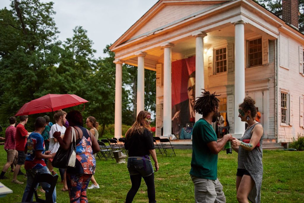 STRAWBERRY MANSION FAMILY REUNION Strawberry Mansion residents mingle on the lawn of the Hatfield House at an art and storytelling event hosted by Amber Art and Design in July. (Albert Yee for Fairmount Park Conservancy)