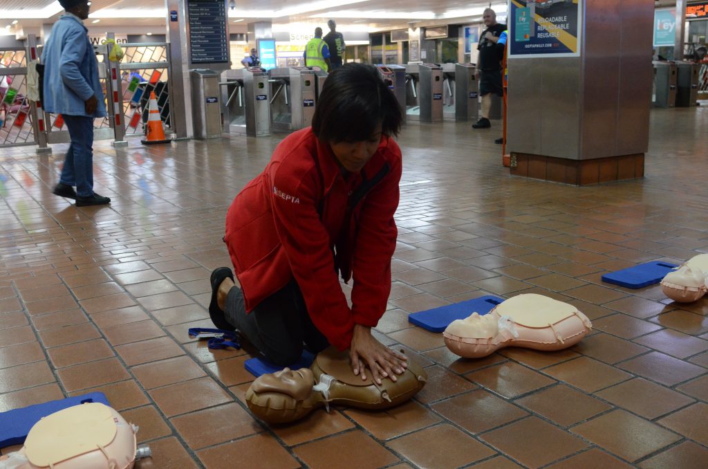 cpr SEPTA Ambassador Carrie Givhan demonstrates CPR on a dummy at Jefferson Station. (Tom MacDonald/WHYY)