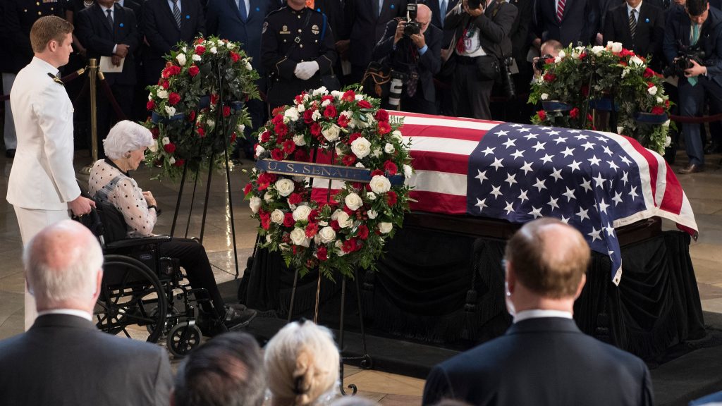Roberta McCain, mother of John McCain, pays respects before his flag-draped casket Friday at the Capitol rotunda. His final public memorial is Saturday at the National Cathedral. Roberta McCain, mother of John McCain, pays respects before his flag-draped casket Friday at the Capitol rotunda. His final public memorial is Saturday at the National Cathedral. (Jim Watson/AFP/Getty Images)
