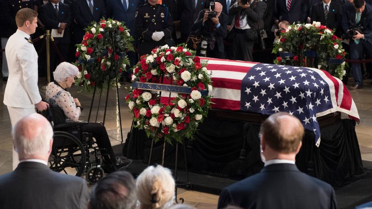 Roberta McCain, mother of John McCain, pays respects before his flag-draped casket Friday at the Capitol rotunda. His final public memorial is Saturday at the National Cathedral. (Jim Watson/AFP/Getty Images)