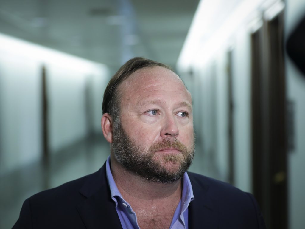 Alex Jones of InfoWars talks to reporters outside a Senate Intelligence Committee hearing on Wednesday. Twitter has permanently suspended the conspiracy theorist, citing violations of its policy on abusive behavior. Alex Jones of InfoWars talks to reporters outside a Senate Intelligence Committee hearing on Wednesday. Twitter has permanently suspended the conspiracy theorist, citing violations of its policy on abusive behavio