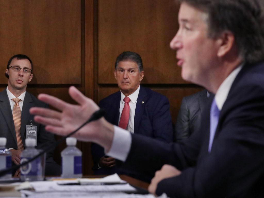 Sen. Joe Manchin, D-W.Va., listens to Supreme Court nominee Judge Brett Kavanaugh as he testifies before the Senate Judiciary Committee on Sept. 6. Running a tight reelection race in a conservative state, Manchin has faced pressure to support Kavanaugh. Sen. Joe Manchin, D-W.Va., listens to Supreme Court nominee Judge Brett Kavanaugh as he testifies before the Senate Judiciary Committee on Sept. 6. Running a tight reelection race in a conservative state, Manchin has faced pressure to support Kavanaugh.