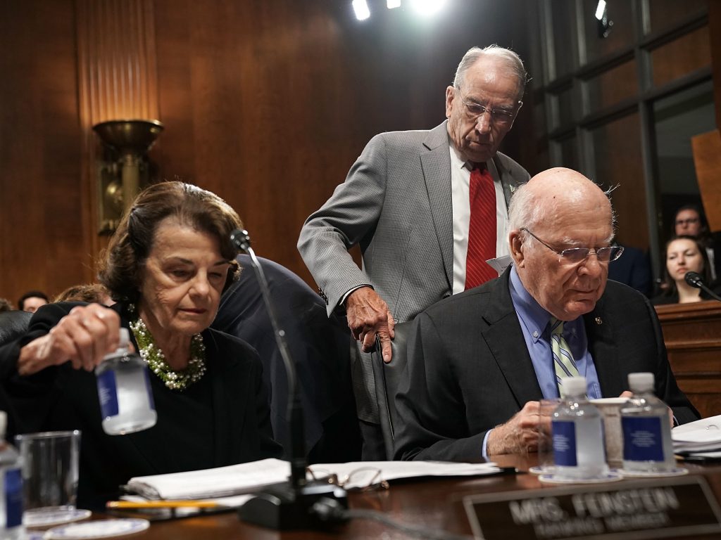 Democratic Sens. Dianne Feinstein and Patrick Leahy (seated) with Judiciary Committee Chairman Chuck Grassley. Democratic Sens. Dianne Feinstein and Patrick Leahy (seated) with Judiciary Committee Chairman Chuck Grassley.
(Alex Wong/Getty Images)