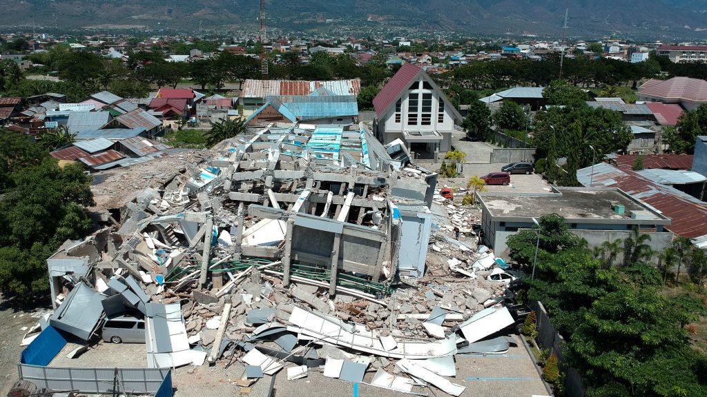 This aerial picture shows the remains of a 10-story hotel in Palu in Indonesia’s Central Sulawesi on Sunday. This aerial picture shows the remains of a 10-story hotel in Palu in Indonesia's Central Sulawesi on Sunday. (Azwar/AFP/Getty Images)