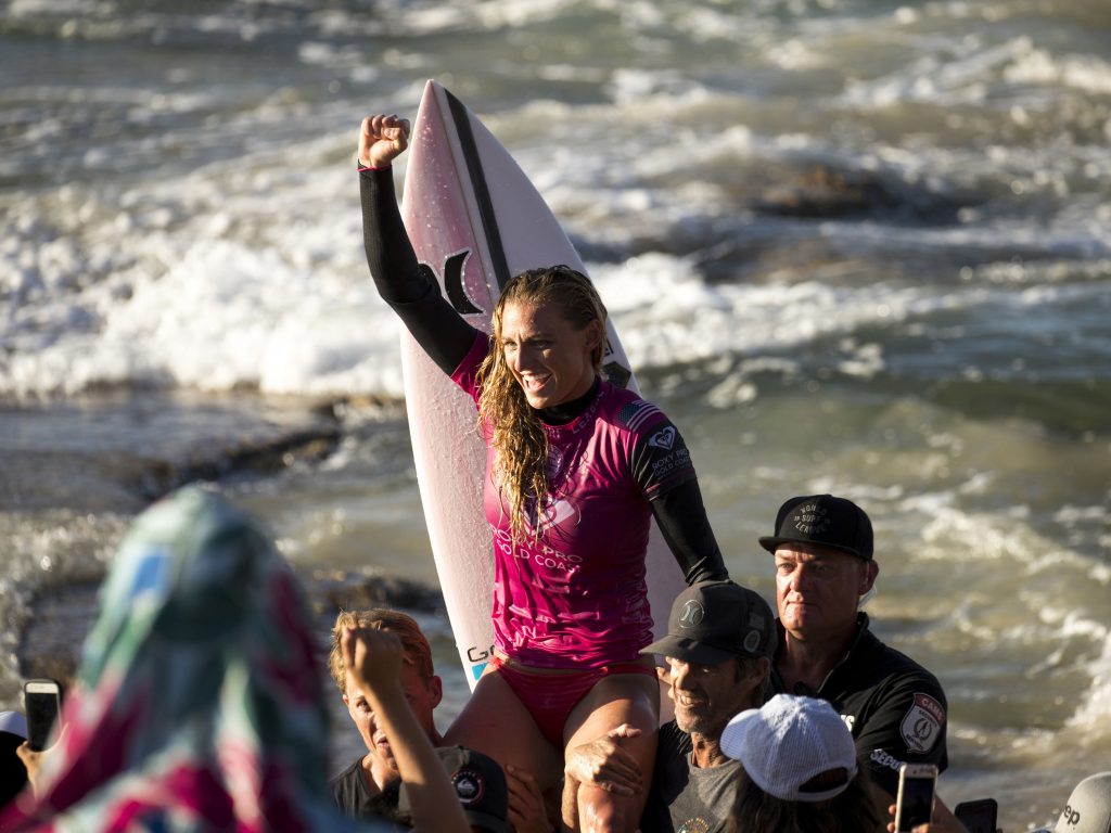 U.S. surfer Lakey Peterson is carried up the beach after claiming victory in a World Surf League event in Australia in March. The league says it will start paying the same prize money to men and women. U.S. surfer Lakey Peterson is carried up the beach after claiming victory in a World Surf League event in Australia in March. The league says it will start paying the same prize money to men and women. (Jason Childs/Getty Images)