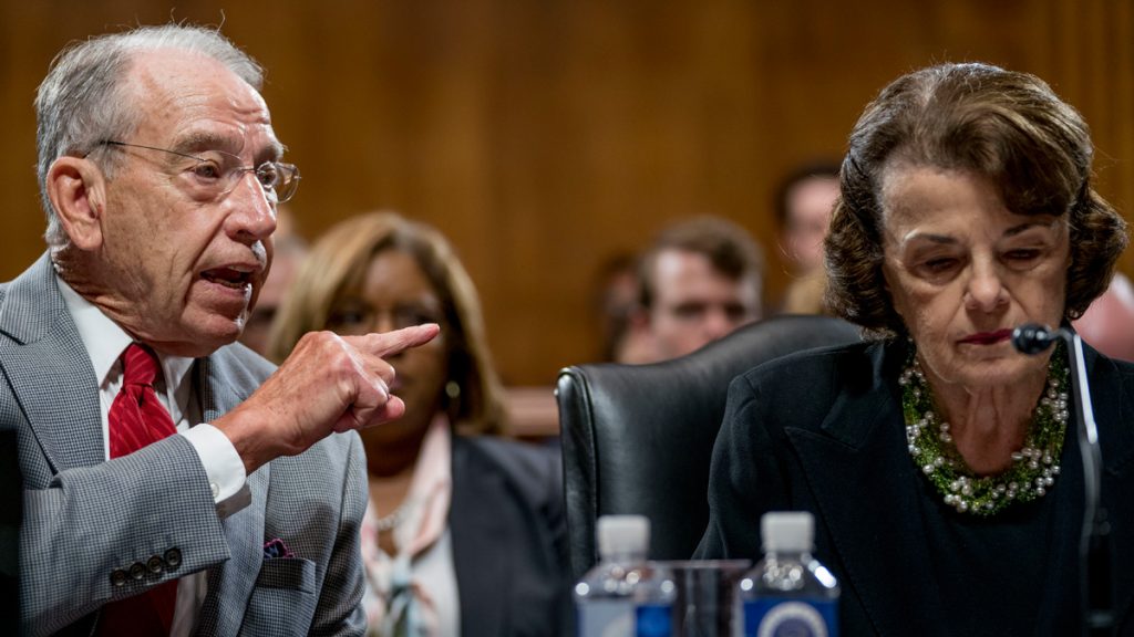 Senate Judiciary Committee Chairman Chuck Grassley, R-Iowa, left, accompanied by Sen. Dianne Feinstein, D-Calif., the ranking member, right, speaks during a Senate Judiciary Committee markup meeting on Capitol Hill, Thursday, Sept. 13, 2018, in Washington. The committee will vote next week on whether to recommend President Donald Trump's Supreme Court nominee, Brett Kavanaugh for confirmation. Republicans hope to confirm him to the court by Oct. 1.(AP Photo/Andrew Harnik)