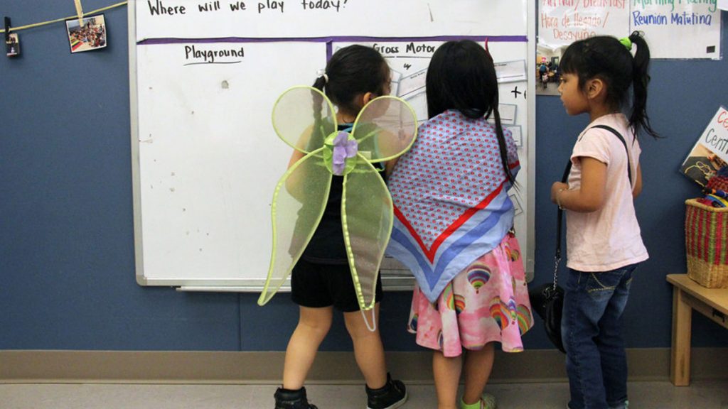 kids16x9 Students play dress-up and draw on a whiteboard in a Christopher House preschool class. (Jackie Mader/The Hechinger Report)