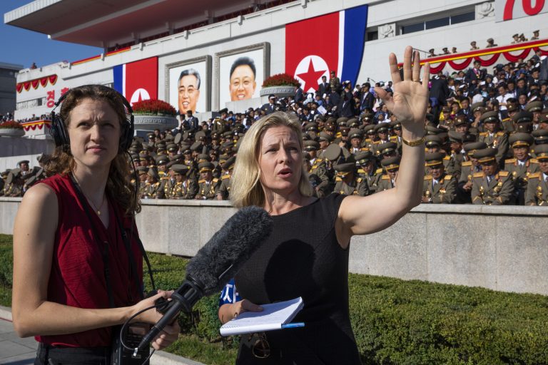 All Things Considered host Mary Louise Kelly (right) records a standup with producer Becky Sullivan at Kim Il Sung Square in Pyongyang ahead of a military parade marking the 70th anniversary of North Korea's founding.
(David Guttenfelder/for NPR)