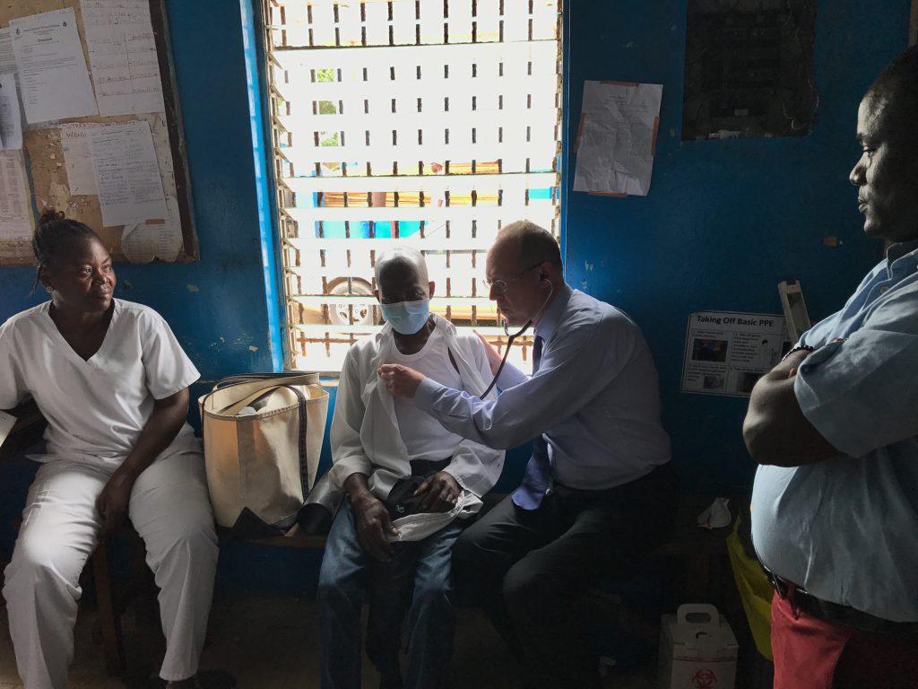 Dr. Paul Farmer examines a tuberculosis patient in Monrovia, Liberia. Dr. Paul Farmer examines a tuberculosis patient in Monrovia, Liberia. (Katherine Kralievits / PIH)