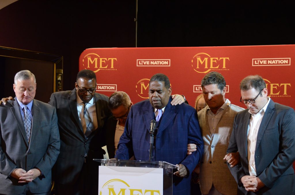pray 9-10 City officials and developers pray at Monday's announcement on the historic Met's reopening in Decemebr. (Tom MacDonald/WHYY)