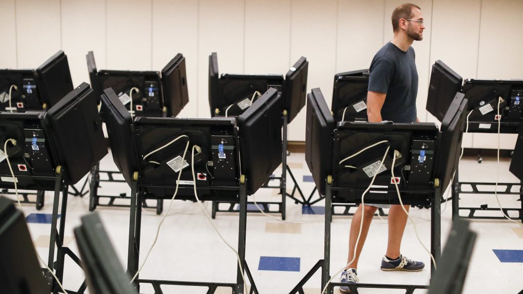 Voters cast their ballots in August among an array of electronic voting machines in a polling station at the Noor Islamic Cultural Center in Dublin, Ohio. The machines were manufactured by Elections Systems and Software, the largest manufacturer of voting equipment in the country. Voters cast their ballots in August among an array of electronic voting machines in a polling station at the Noor Islamic Cultural Center in Dublin, Ohio. The machines were manufactured by Elections Systems and Software, the largest manufacturer of voting equipment in the country. (John Minchillo/AP)