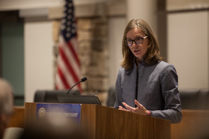 Jennifer Leith, Chairman of the the Haverford Township Human Relations Commission, addressed residents gathered together at the new Haverford Township Building. They met for a town hall to address racism and racial bias in the Haverford Township school district. (Emily Cohen for WHYY)