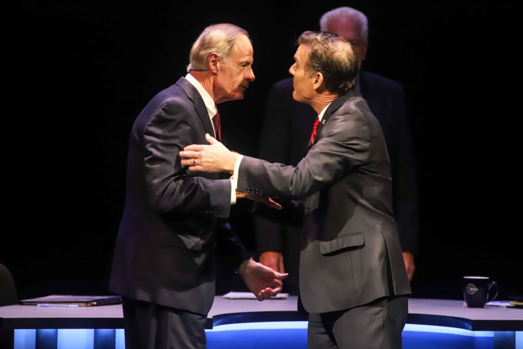 Incumbent Democrat U.S. Representative Lisa Blunt Rochester shakes hands with Republican U.S. House candidate Scott Walker prior to a U.S. House debate Incumbent Democrat U.S. Sen. Tom Carper (left) shakes hands with Republican challenger Rob Artlett prior to their debate that later grew contentious. Wednesday night. (Saquan Simpson for WHYY)