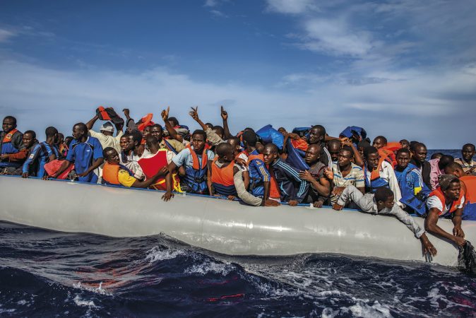 One hundred nine African refugees from Gambia, Mali, Senegal, Ivory Coast, Guinea,and Nigeria are rescued by the Italian navy from a rubber boat in the sea between Italyand Libya, October 2014.