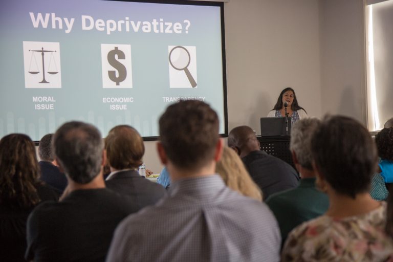 In this 2018 file photo, Kabeera Weissman, a co-founder of DelcoCPR, lays out the reasons the group and other residents want the privately managed George W. Hill Correctional Facility in the the public's control. (Emily Cohen for WHYY)