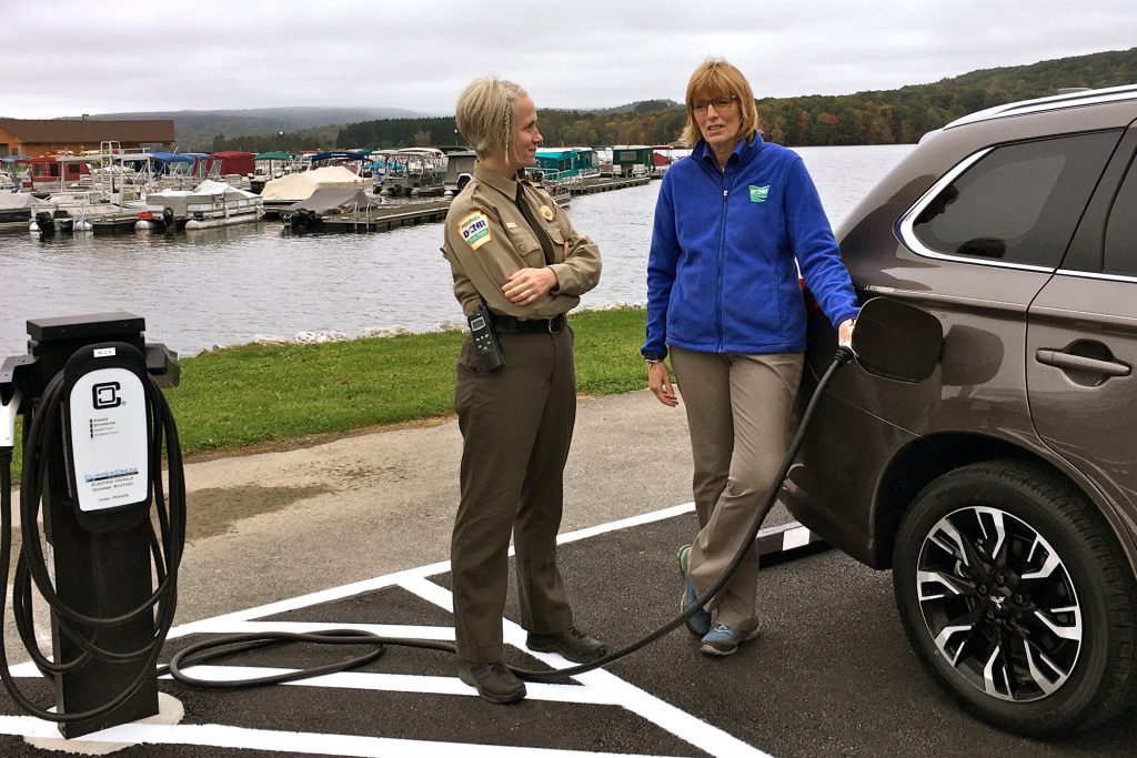 2018 10 05-provided-jessica lavelua cindy adams dunn-prince gallitzin state park-electric vehicle charging station Prince Gallitzin State Park Manager Jessica Lavelua (left) and Department of Conservation and Natural Resources Secretary Cindy Adams Dunn demonstrate an electric vehicle charging station.
