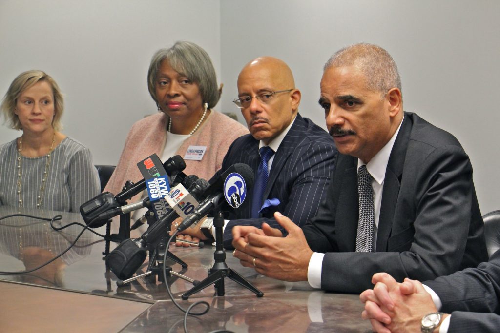 2018 10 11-e lee-eric holder-philadelphia-pennsylvania redistricting Former U.S. Attorney General Eric Holder (right) throws his weight behind six Democratic Pennsylvania Senate candidates he says will bring an end to partisan gerrymandering in the state. (Emma Lee/WHYY)