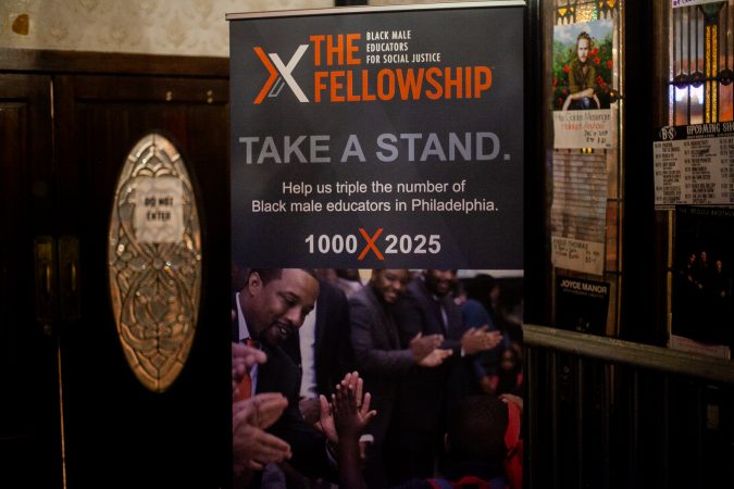 A banner promoting the organization The Fellowship: Black Male Educators for Social Justice seen inside of Union Transfer where events for the organization's second annual convention were held Friday evening. (Brad Larrison for WHYY)