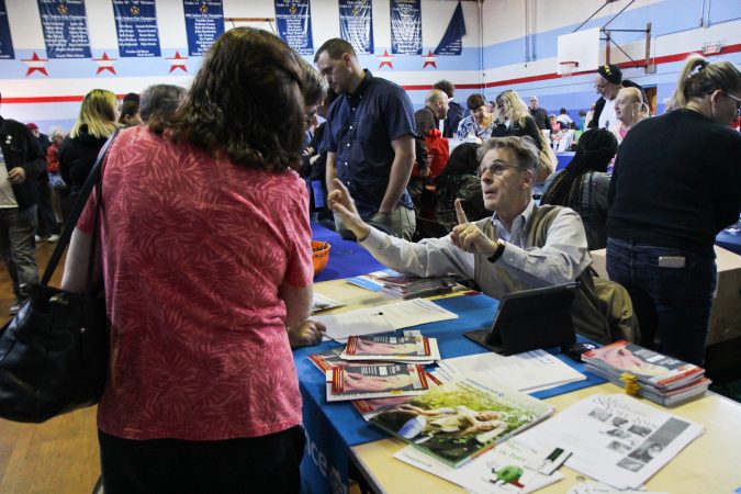 Vendors including health insurance providers, physical trainers, and SEPTA, give out information to seniors at the senior expo in Port Richmond. (Kimberly Paynter/WHYY)