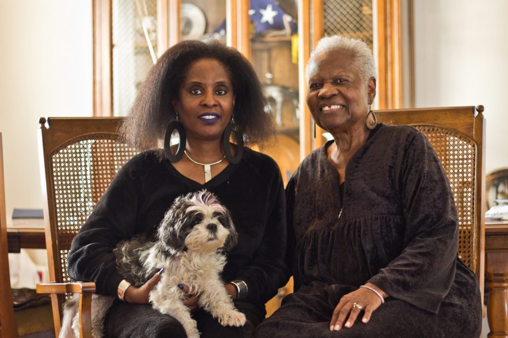 Lisa Strickland and her mother Ann say they love their Eastwick neighborhood. (Kimberly Paynter/WHYY)