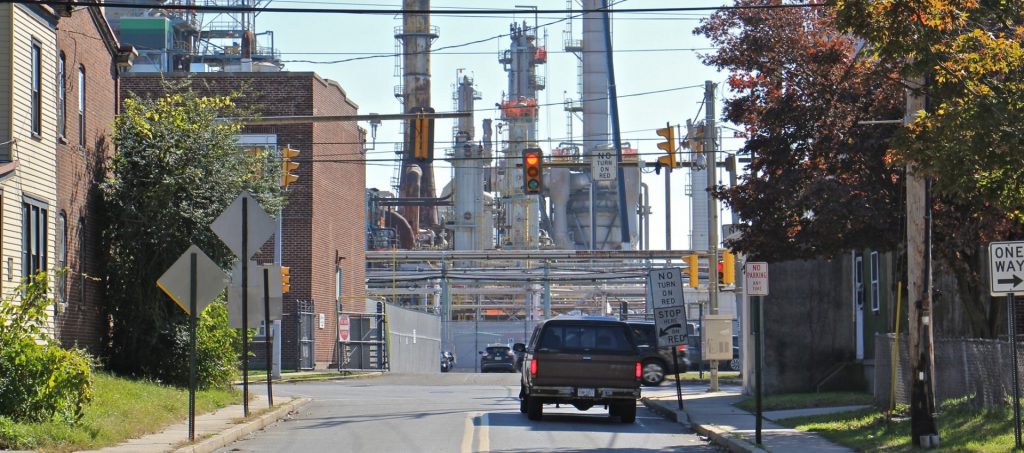 2018-10-30-e-lee-monroe-energy-marcus-hook-renewable-energy-credits-rins-refinery-5-e1540934994529-1920×849 Main Street in Marcus Hook dead ends at the Monroe Energy refinery. (Emma Lee/WHYY)