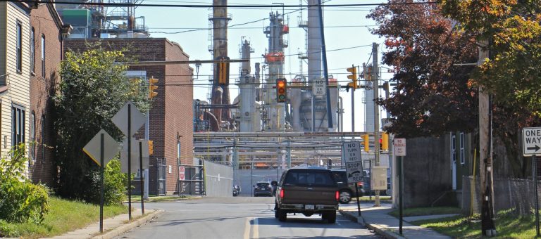Main Street in Marcus Hook dead ends at the Monroe Energy refinery. (Emma Lee/WHYY)