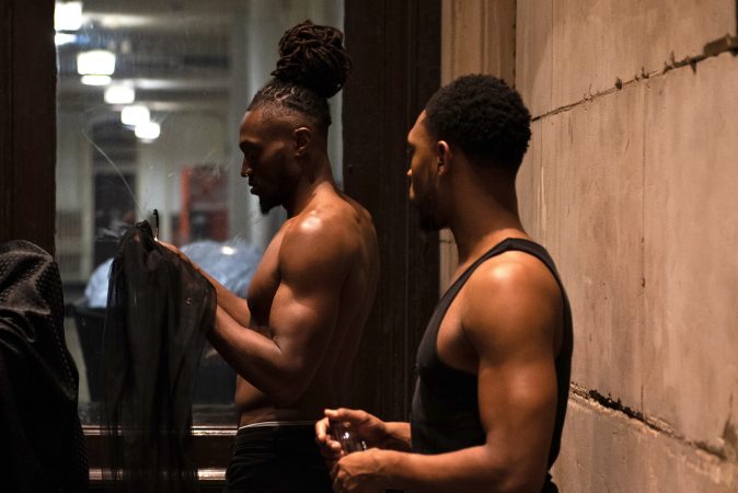 Models prep backstage before the Friday night runway show at Philadelphia Fashion Week, held at Dilworth Park. (Kriston Jae Bethel for WHYY)