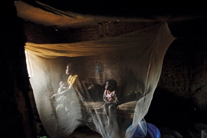 Kahindo, twenty, sits in her home with her two children born out of rape in NorthKivu Province, eastern Congo, April 2008.Prisoners wait